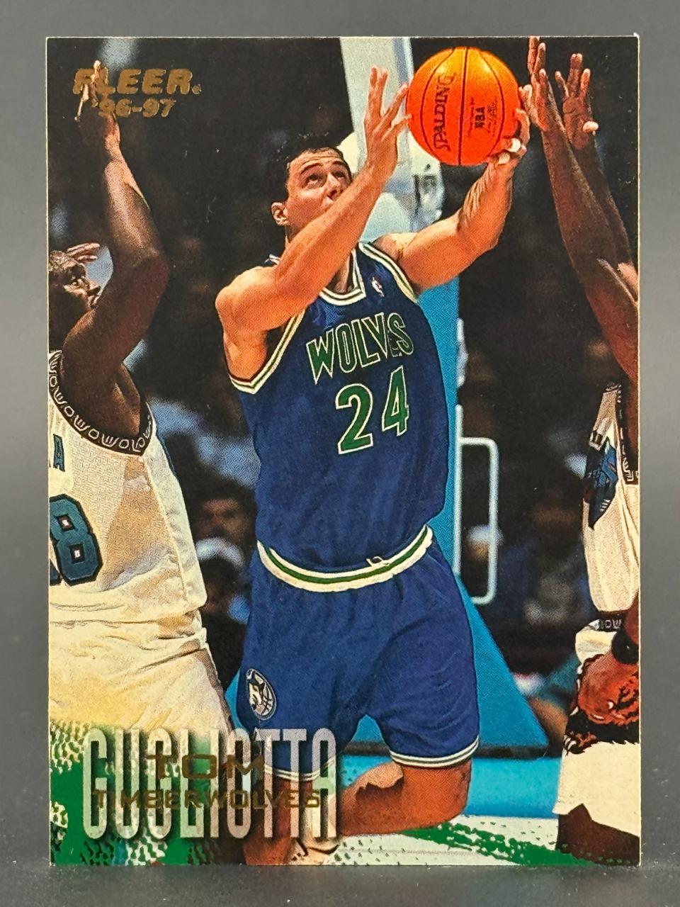 1996-97 Fleer Tom Gugliotta basketball card #24, featuring him shooting past defenders.