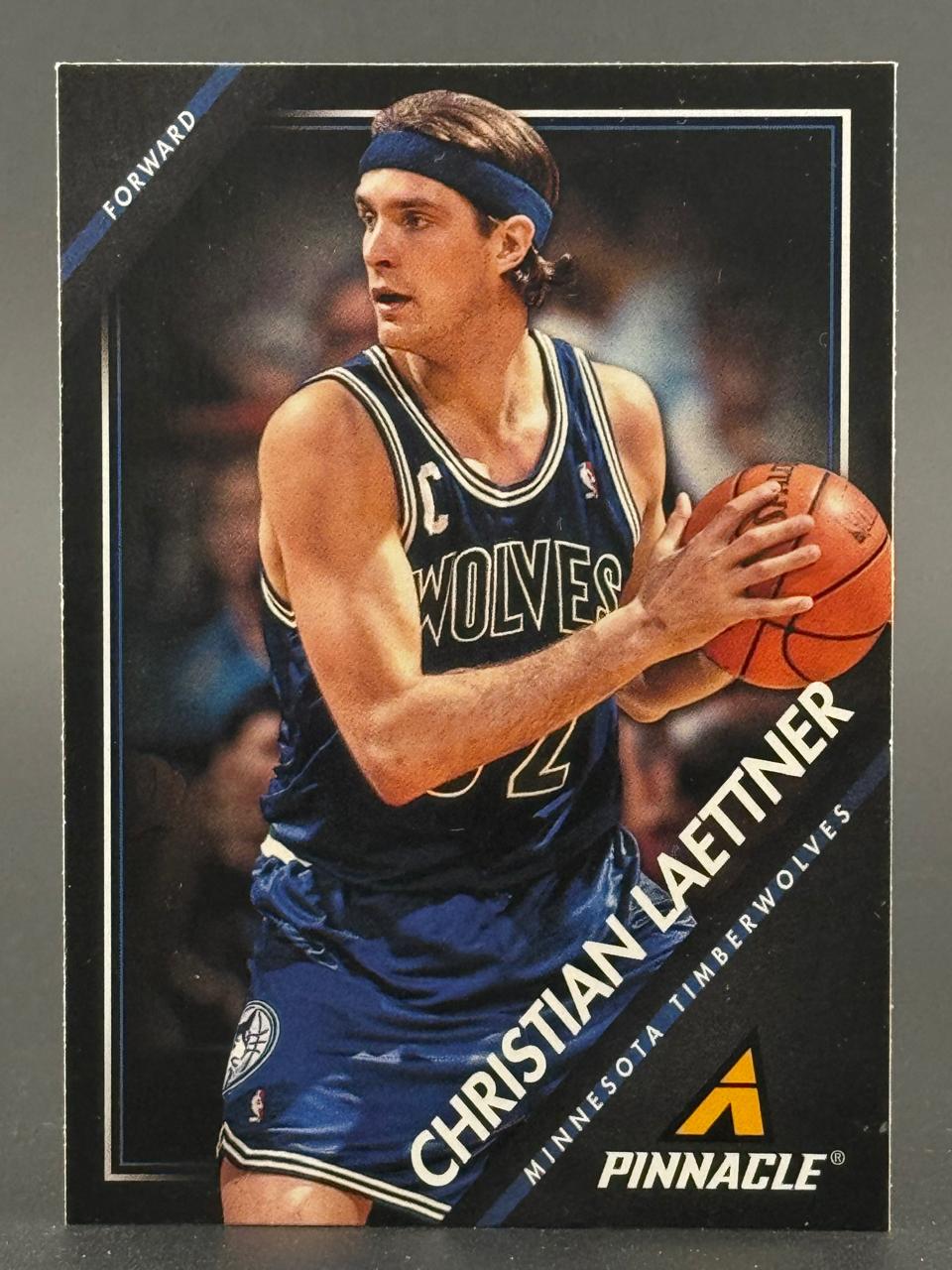 Christian Laettner basketball trading card, Pinnacle, Minnesota Timberwolves, holding a basketball.
