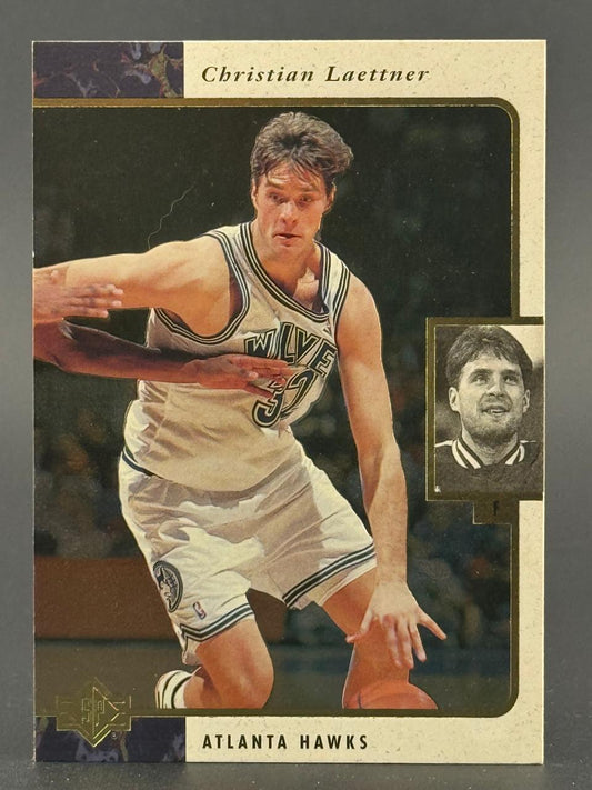 Christian Laettner basketball trading card featuring him dribbling in an Atlanta Hawks uniform.