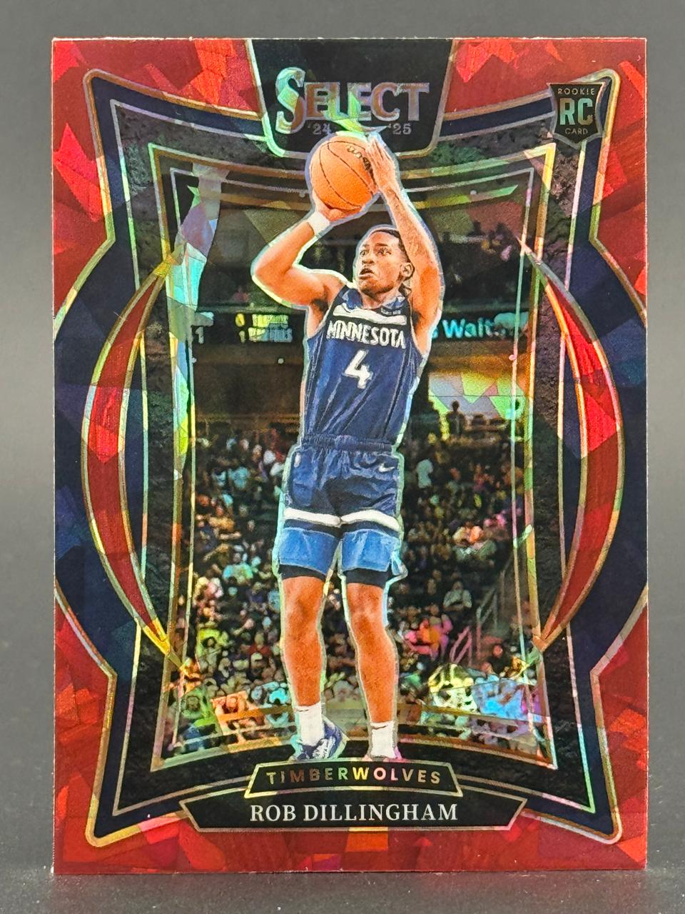 24-25 Select Rob Dillingham Rookie Card featuring him in a Minnesota Timberwolves uniform shooting a basketball.