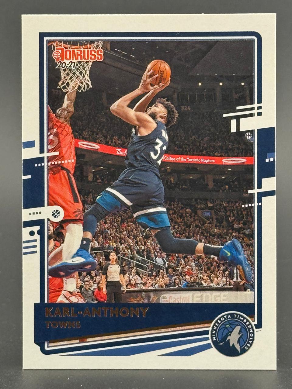 20-21 Donruss Karl-Anthony Towns basketball card featuring him driving to the basket.