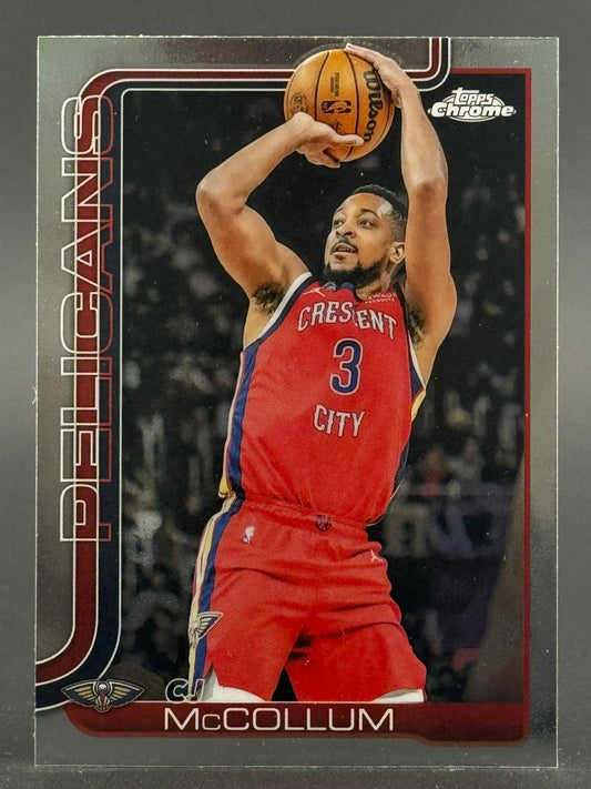 CJ McCollum Topps Chrome trading card showing him shooting a basketball in a Pelicans uniform.