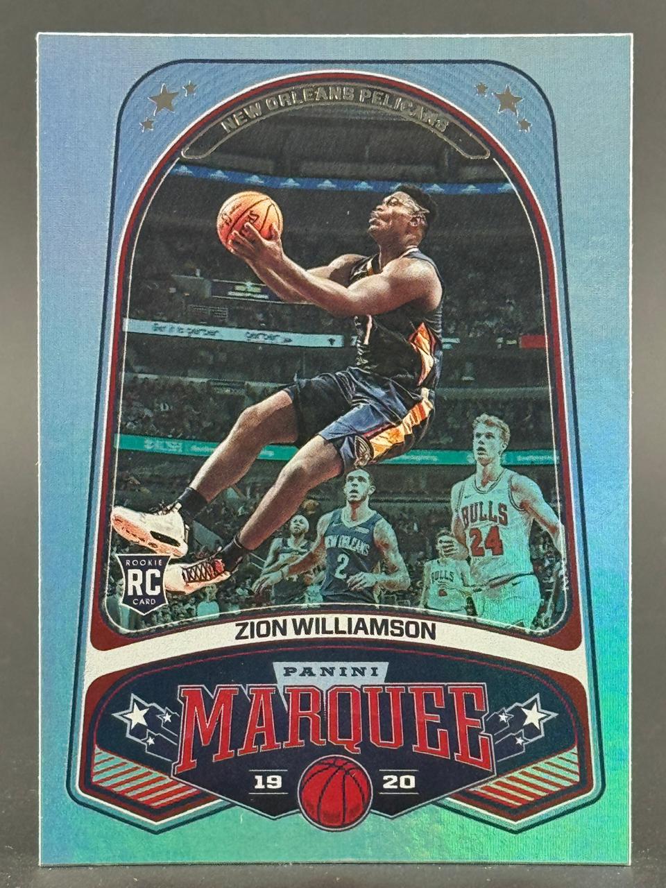 2019-20 Panini Marquee Zion Williamson rookie card featuring him driving for a layup.