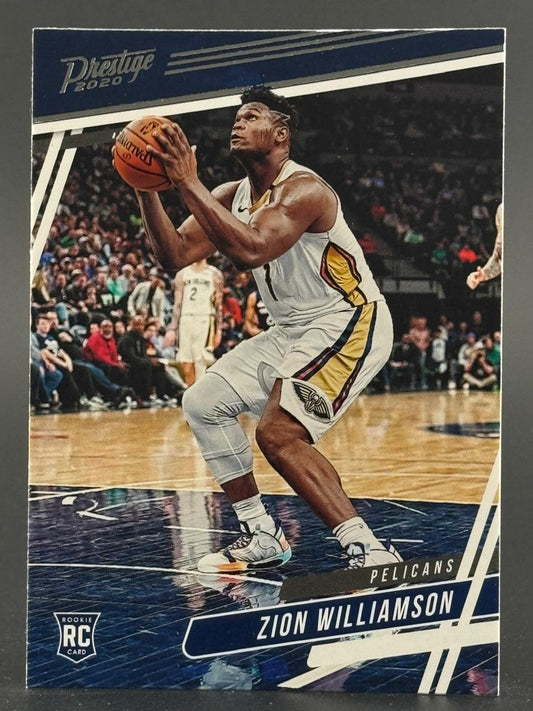 2020 Prestige Zion Williamson rookie basketball card showing him holding a basketball in uniform.