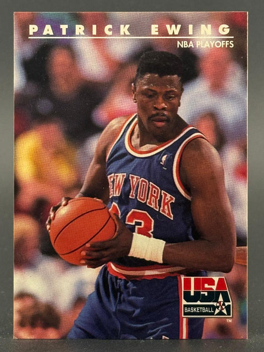 Patrick Ewing basketball card with "NBA Playoffs" text, holding a basketball in a New York uniform.