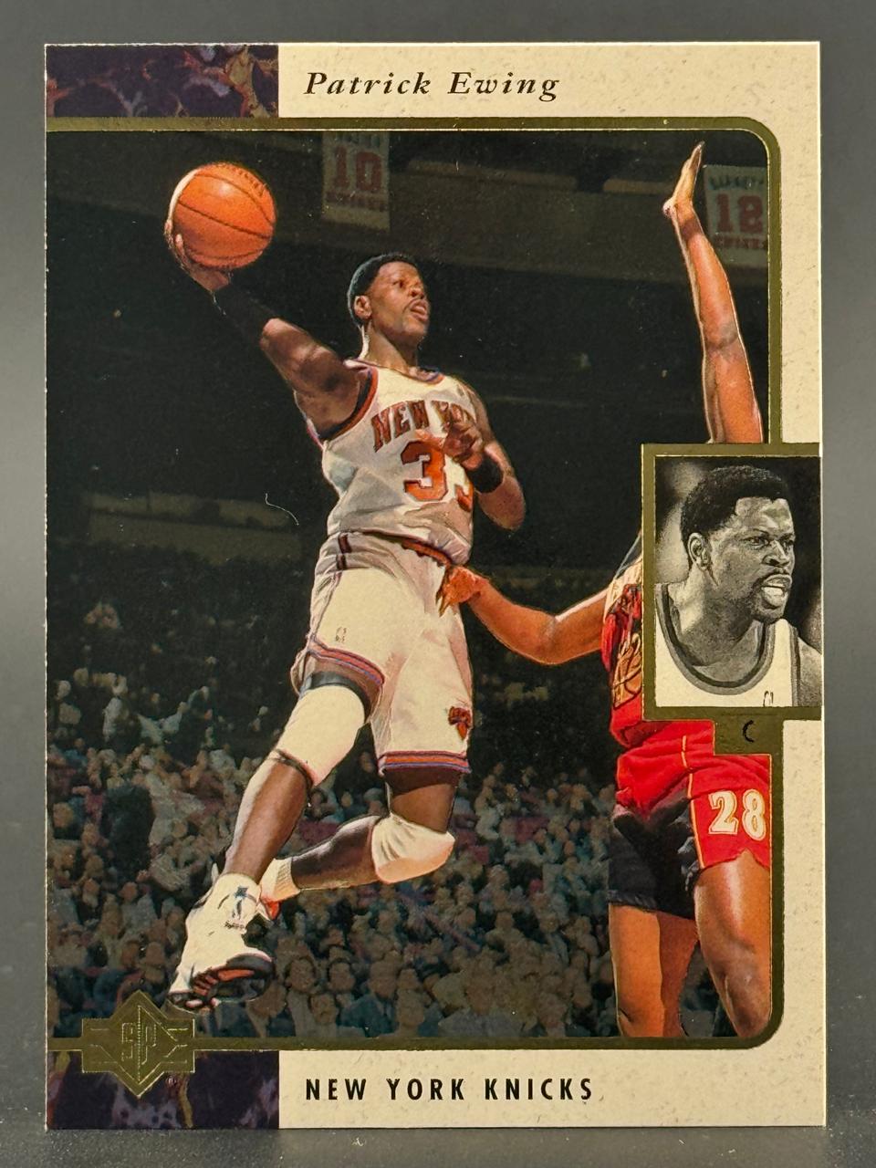 Patrick Ewing basketball trading card showing Ewing driving to the basket in his New York Knicks uniform.