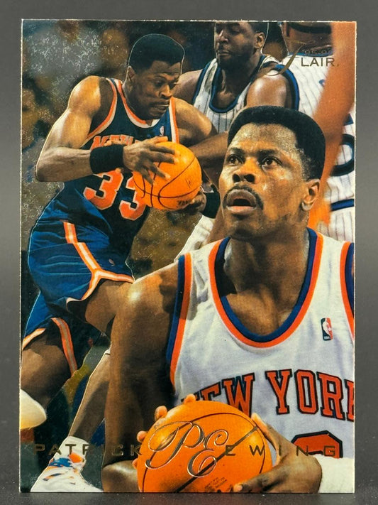 Patrick Ewing trading card featuring multiple images of Ewing in New York Knicks uniforms holding a basketball.