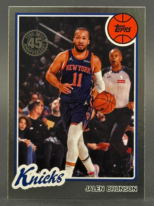 Jalen Brunson 2024-25 Topps Basketball card featuring him dribbling in a New York uniform.