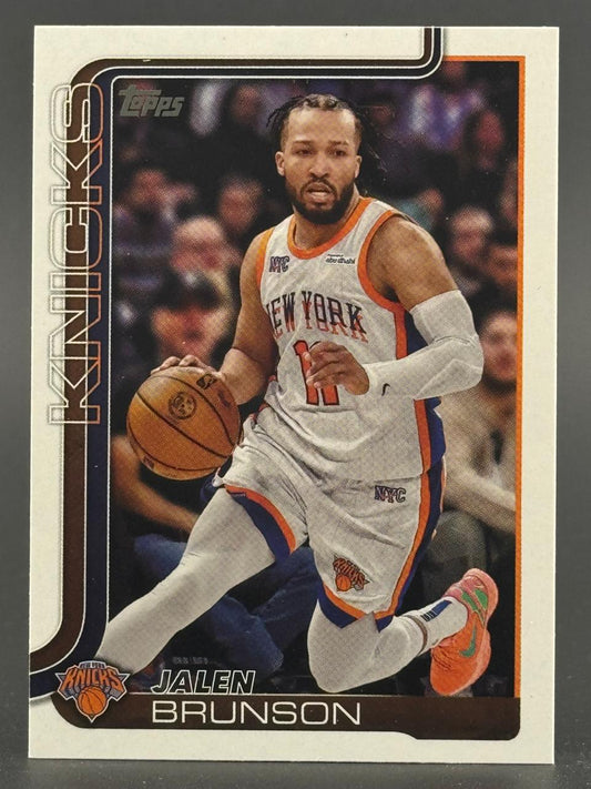 Topps Jalen Brunson basketball card featuring him dribbling in a Knicks uniform.