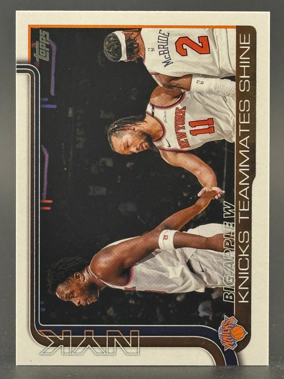 Trading card featuring New York Knicks teammates Miles McBride and Jalen Brunson shaking hands.