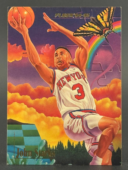 1994-95 Fleer John Starks basketball card #3 showing him in a New York uniform against a surreal background.