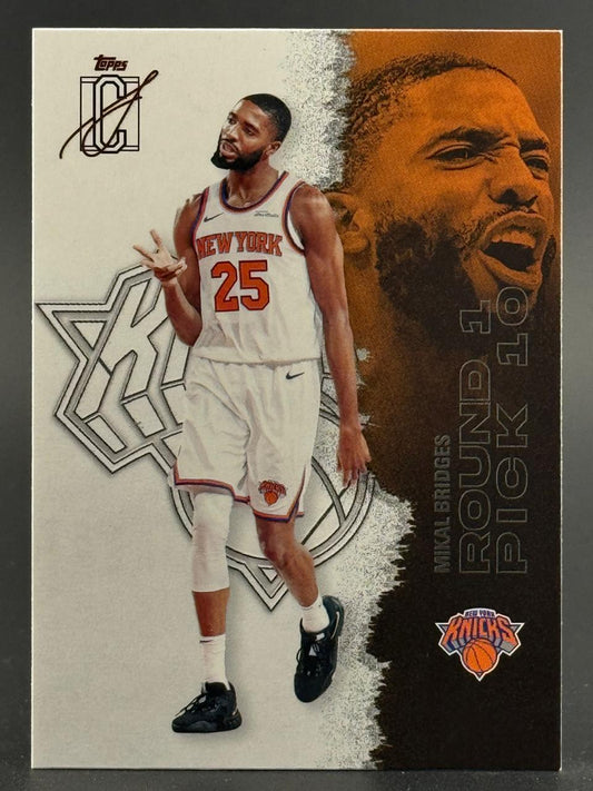 Trading card of Mikal Bridges in a white New York Knicks uniform, featuring a large portrait and "Round 1 Pick 10" text.