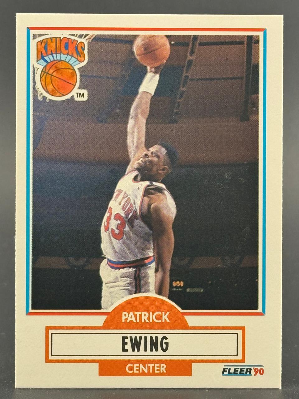 1990 Fleer Patrick Ewing basketball card showing him dunking.
