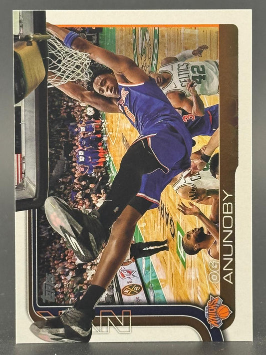 OG Anunoby basketball trading card, showing him dunking in a New York Knicks uniform.