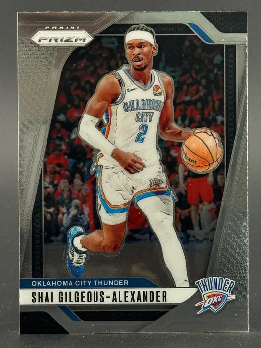 Shai Gilgeous-Alexander 2023-24 Panini Prizm basketball card dribbling in uniform.