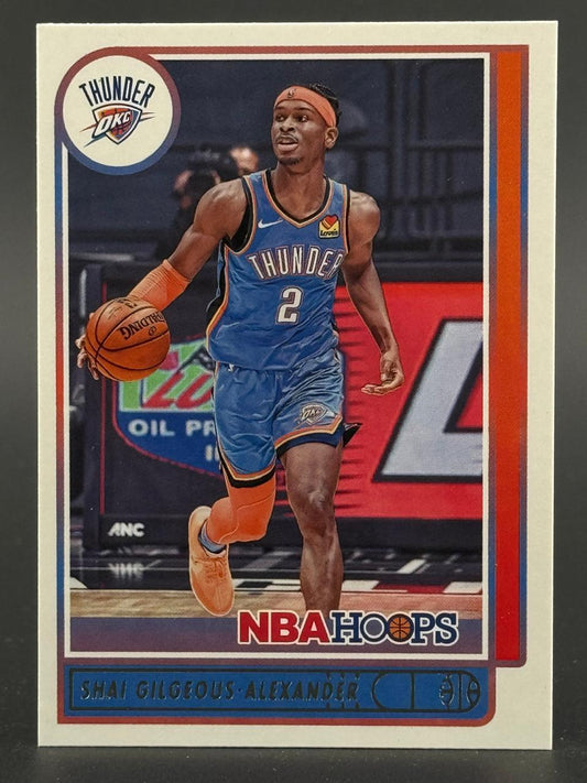 Shai Gilgeous-Alexander 2020-21 NBA Hoops trading card #2 in Thunder uniform dribbling.
