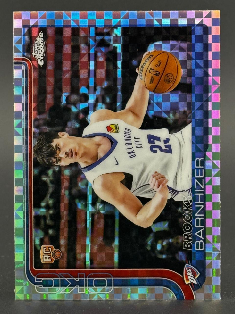 Brooks Barnhizer Topps Chrome rookie card with checkerboard prism refractor finish holding a basketball.