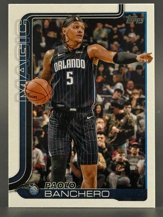 Paolo Banchero Topps trading card, showing him in an Orlando Magic uniform dribbling a basketball.