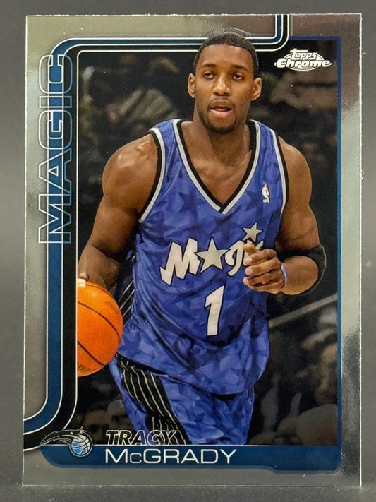 Tracy McGrady Topps Chrome trading card, showing him in a blue Orlando Magic uniform dribbling a basketball.