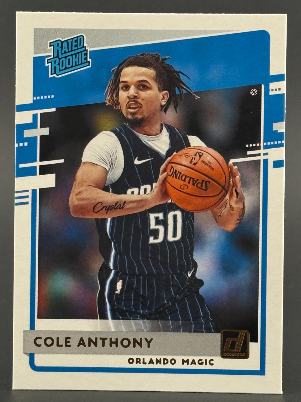 Cole Anthony 2020-21 Donruss Rated Rookie trading card holding a basketball.