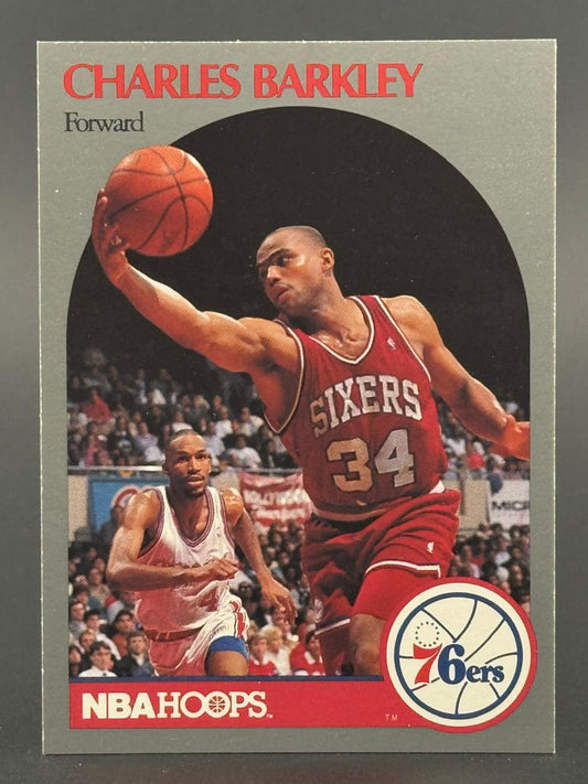 Charles Barkley 1989-90 NBA Hoops basketball card holding a ball in a Sixers uniform.