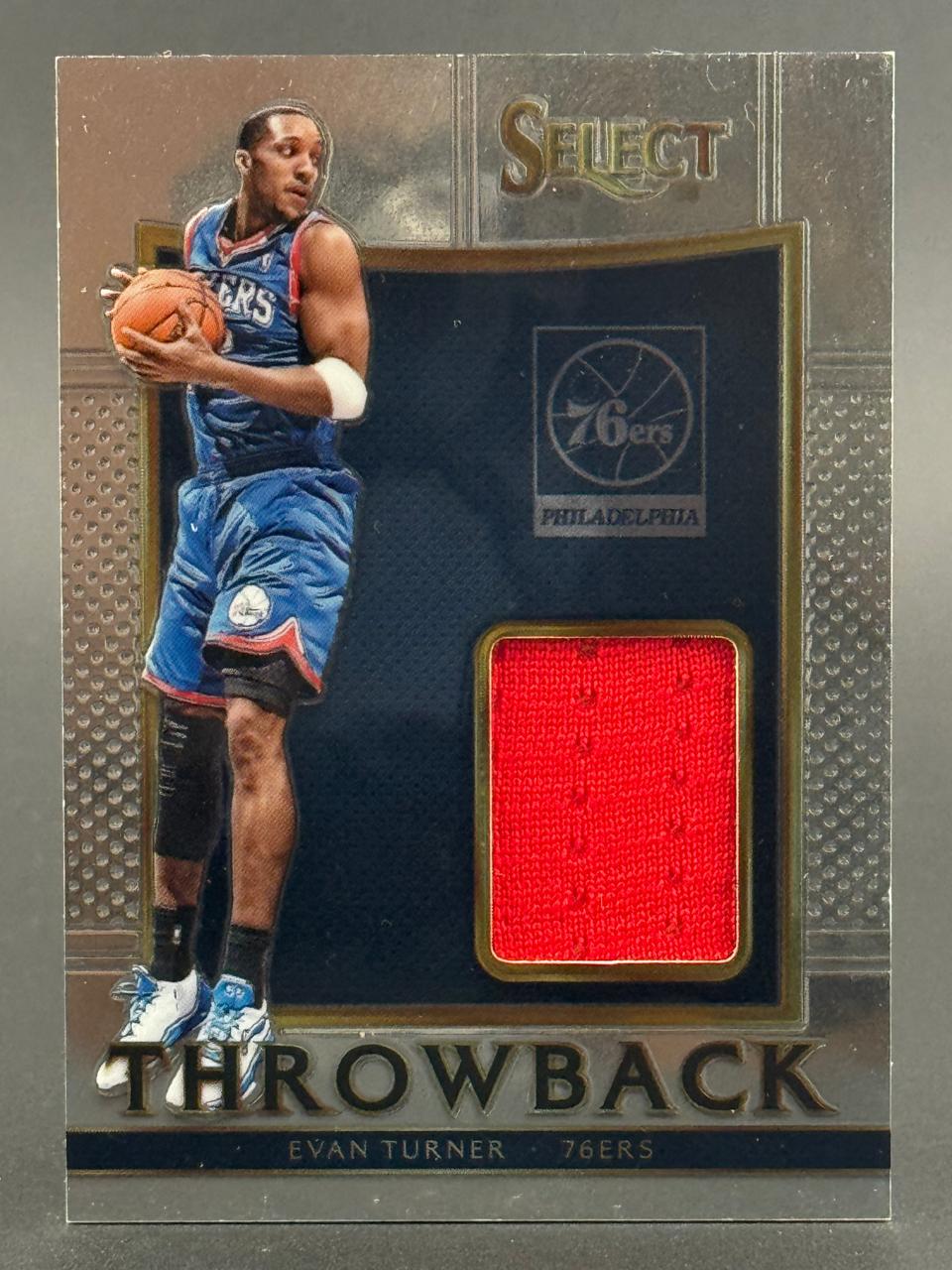 Evan Turner 76ers Select Throwback trading card featuring a red jersey relic swatch.