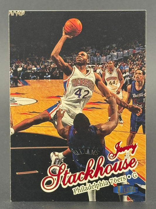 Jerry Stackhouse basketball card showing him driving to the basket in a 76ers uniform.