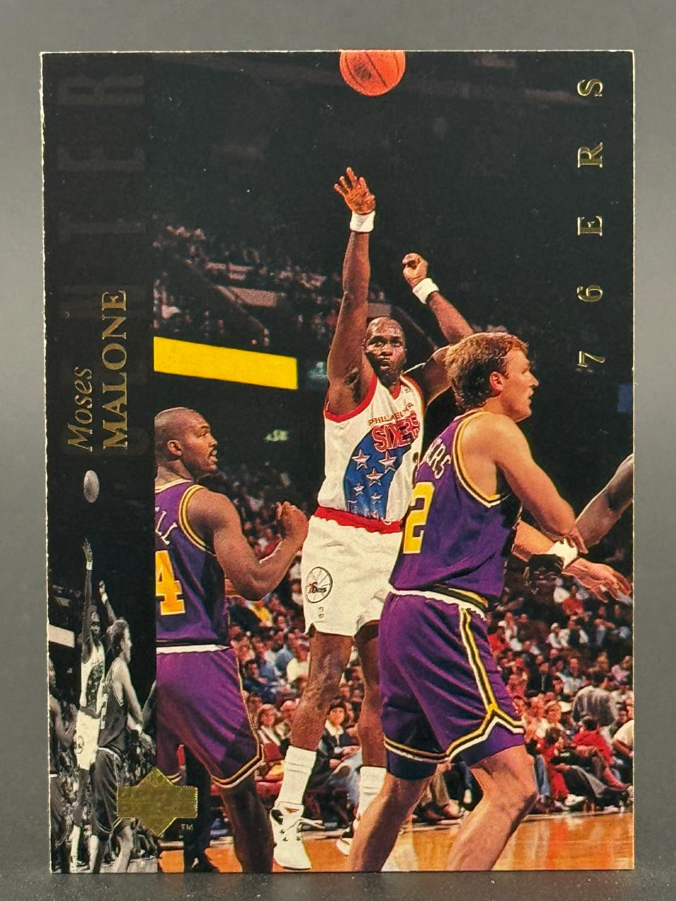 Moses Malone 76ers basketball trading card.