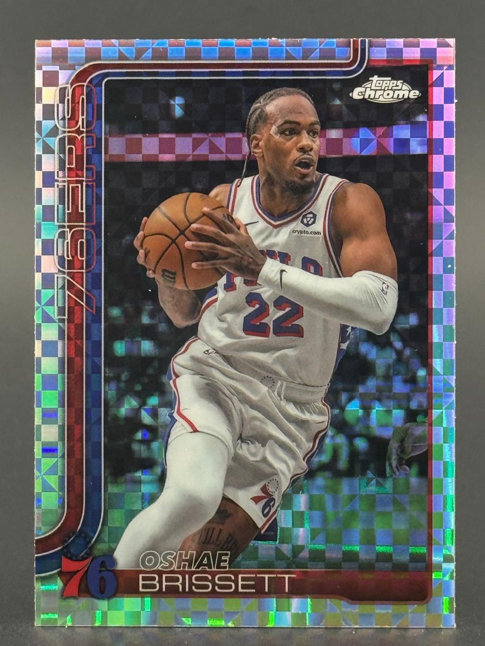 Oshae Brissett 76ers Topps Chrome trading card with a reflective pixel border.