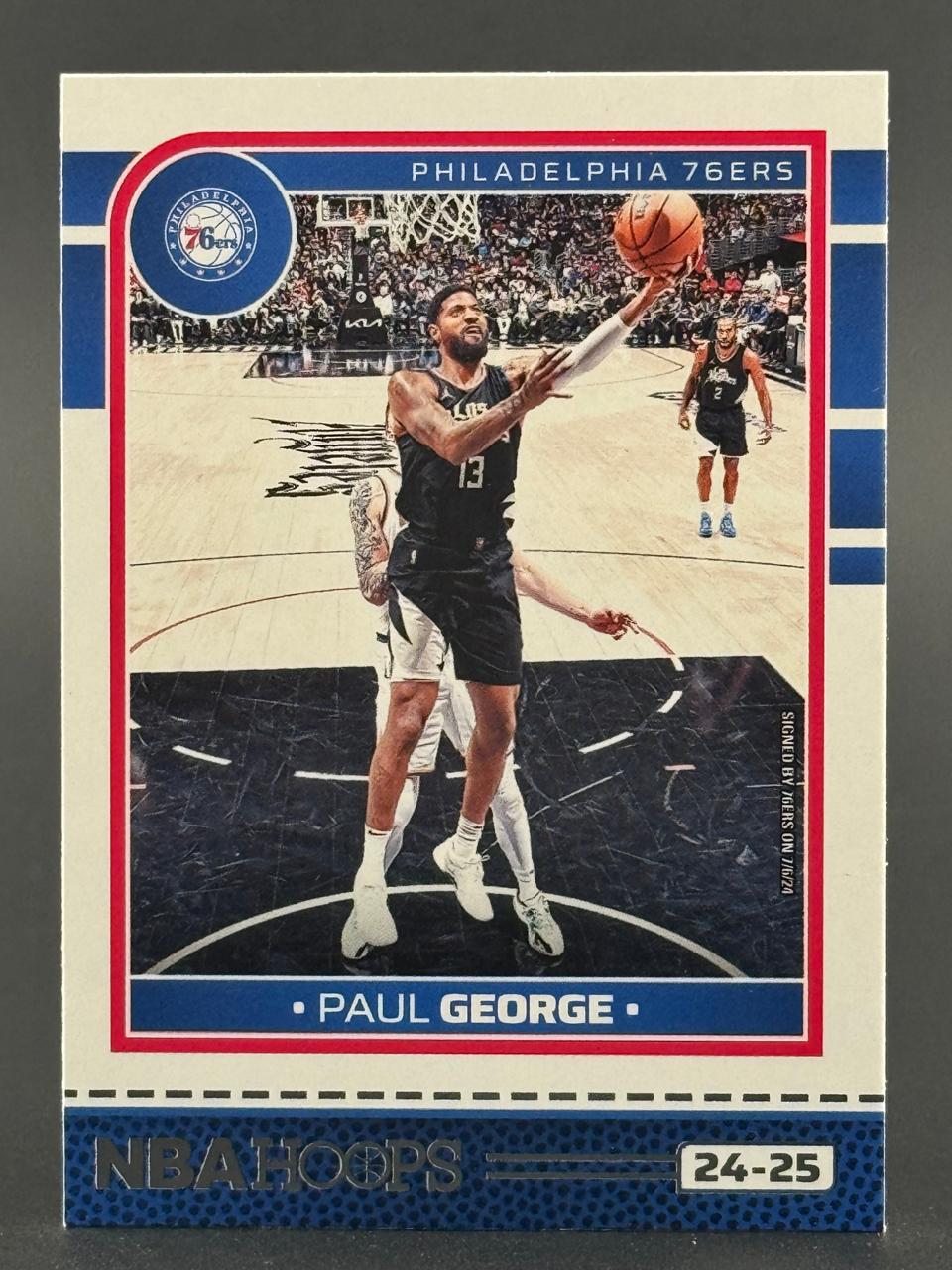 2024-25 NBA Hoops trading card of Paul George, Philadelphia 76ers.