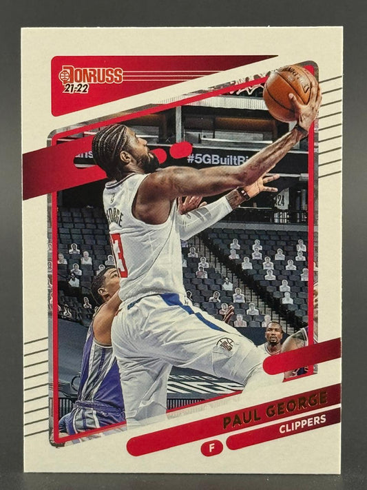 2021-22 Donruss Paul George trading card featuring him in a Clippers uniform driving to the basket.