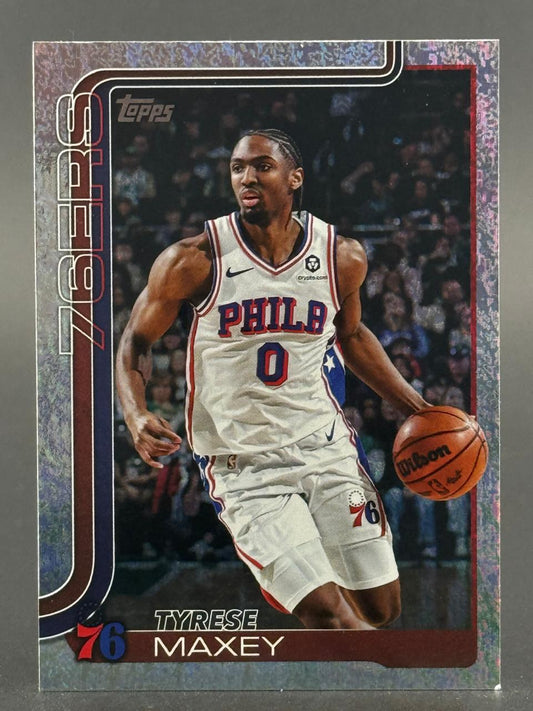 Tyrese Maxey trading card in a 76ers uniform, dribbling a basketball.