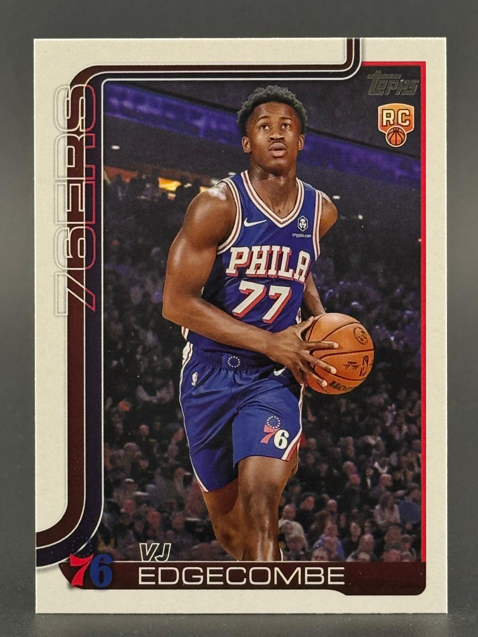 VJ Edgecombe 76ers basketball trading card in a blue uniform holding a basketball, Topps RC logo.