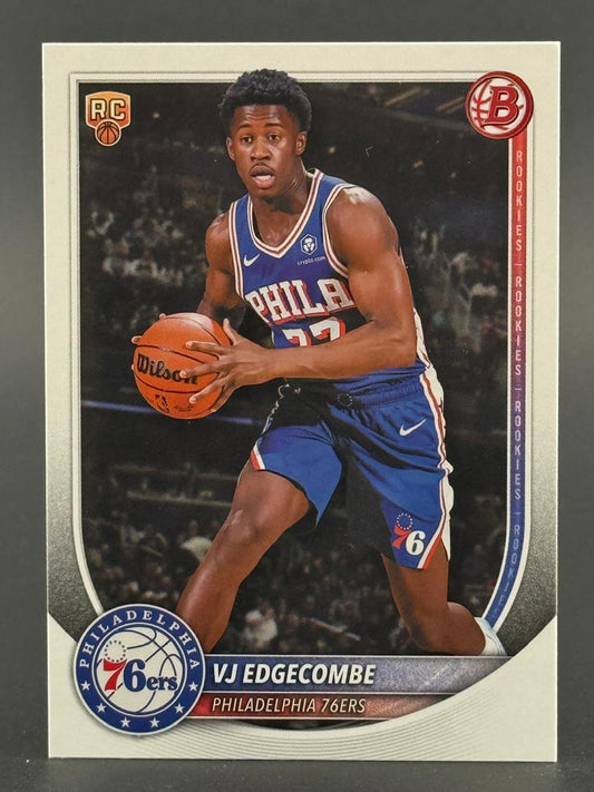 VJ Edgecombe basketball trading card depicting him in a blue Philadelphia 76ers uniform dribbling.