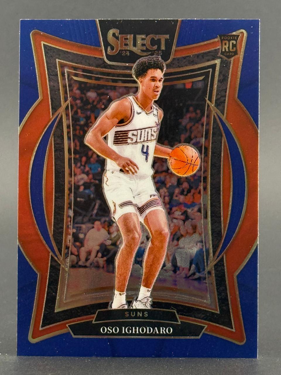 2024-25 Select Oso Ighodaro Rookie Card featuring the Suns player in uniform dribbling a basketball.