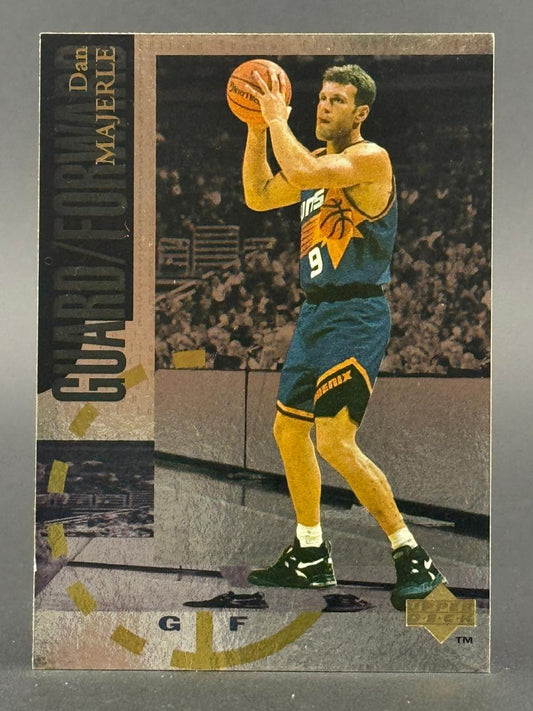 Dan Majerle basketball card, Upper Deck, showing him holding a basketball in a Phoenix Suns uniform.