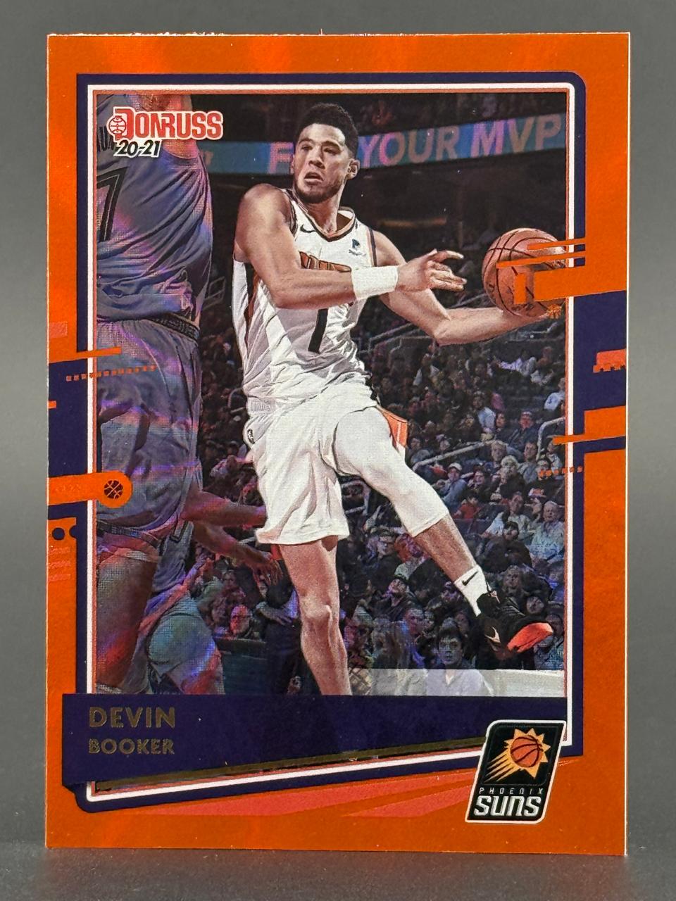 2020-21 Donruss Devin Booker Phoenix Suns basketball card with orange border.