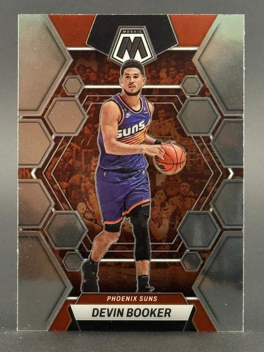 Devin Booker Phoenix Suns basketball trading card featuring a geometric mosaic background pattern.