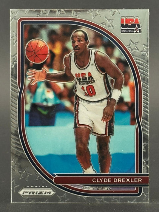 Clyde Drexler Panini Prizm trading card, showing him in a USA Basketball uniform dribbling a basketball.