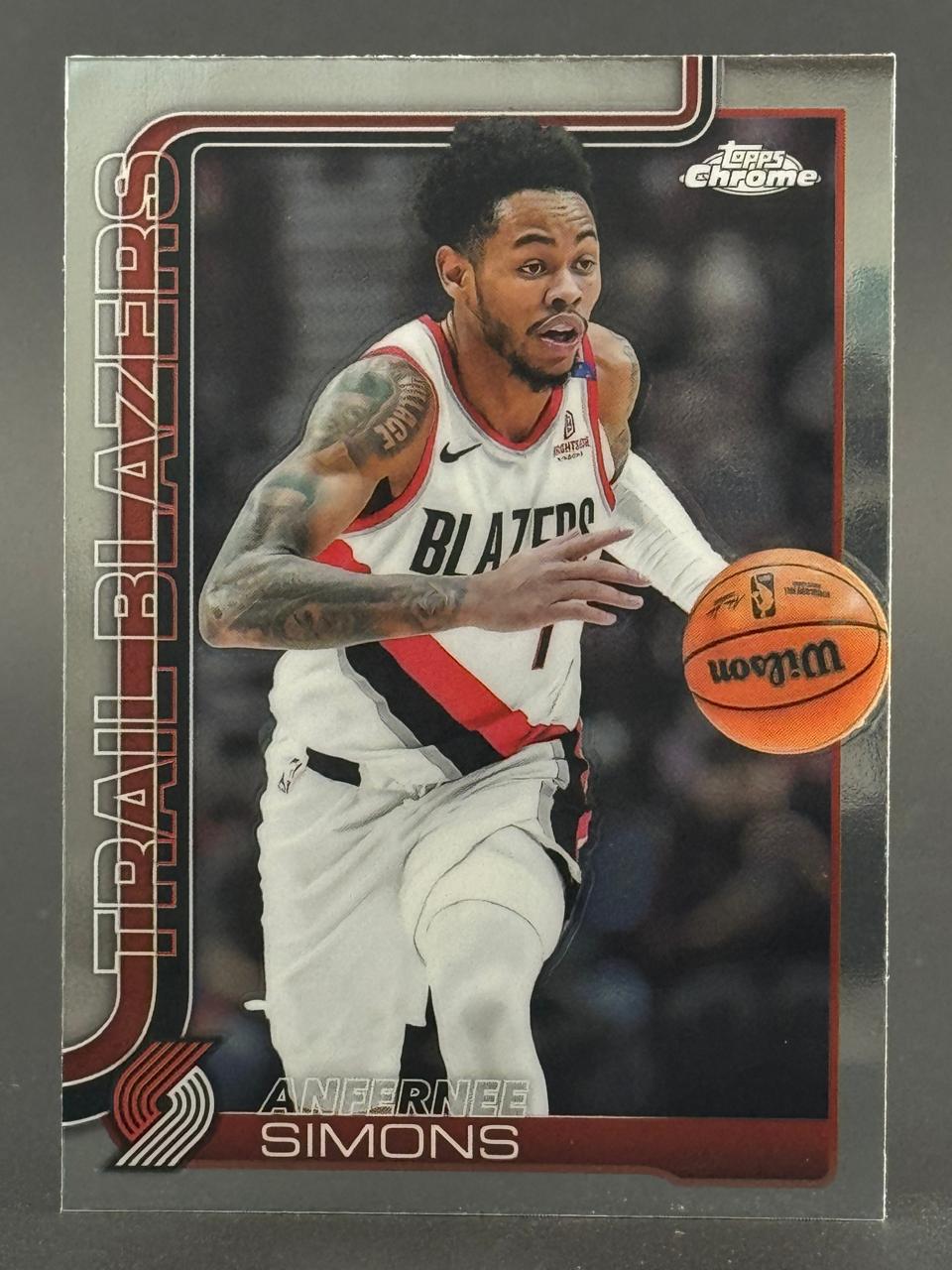 Anfernee Simons Topps Chrome basketball card dribbling a ball.