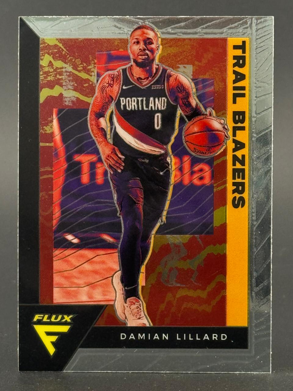 Damian Lillard 2021-22 Panini Flux basketball card featuring him dribbling in a Trail Blazers uniform.
