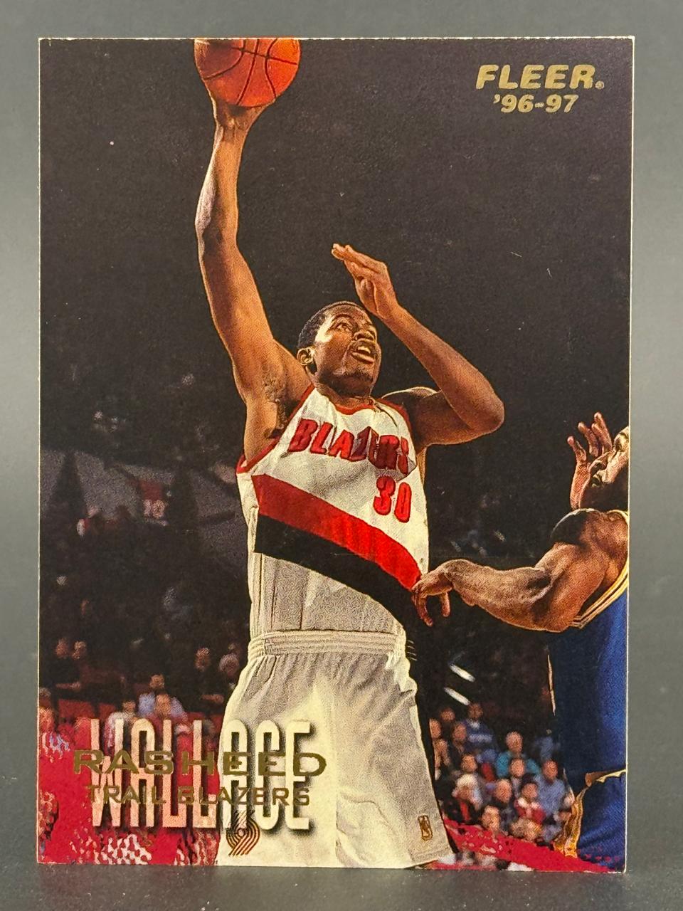 1996-97 Fleer Rasheed Wallace basketball card #30, showing him shooting a jump shot in his Trail Blazers uniform.
