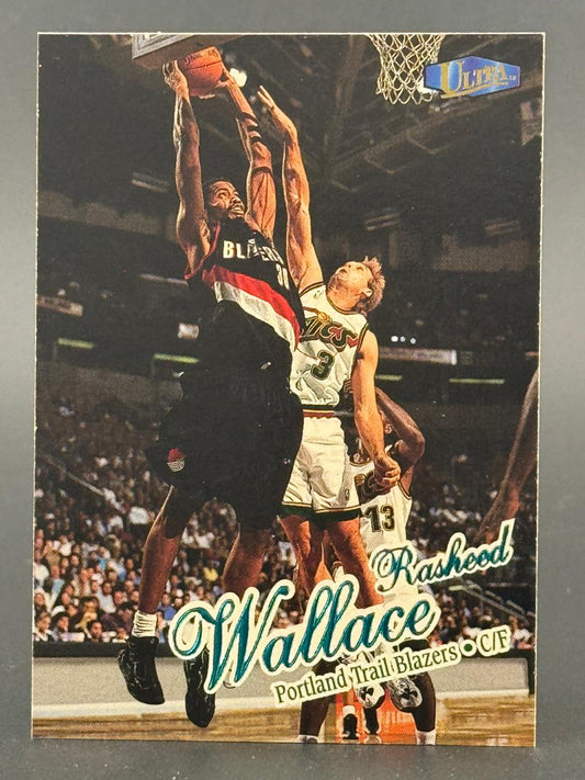 Rasheed Wallace 1996-97 Ultra basketball card featuring him dunking over an opponent.