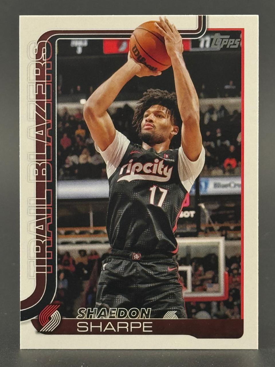 Shaedon Sharpe Topps trading card showing him shooting a basketball in a Trail Blazers uniform.