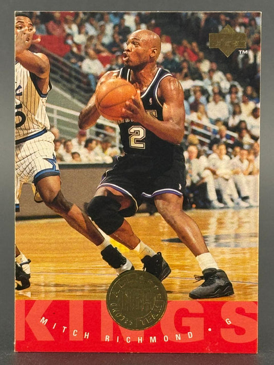 Mitch Richmond trading card, featuring him in a Kings uniform holding a basketball on a court.