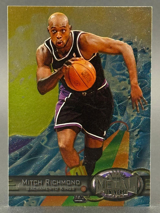 1997-98 Metal Universe Mitch Richmond basketball card featuring him dribbling in a Kings uniform.