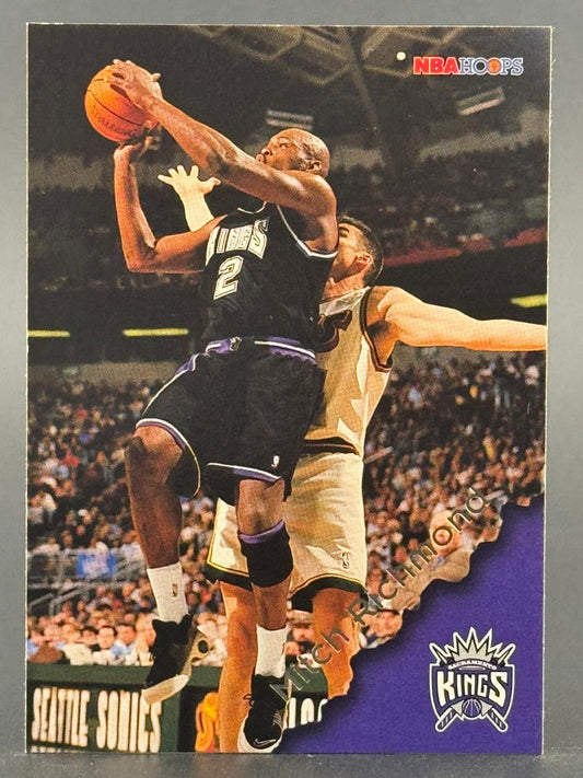 Trading card of Mitch Richmond in a Sacramento Kings uniform playing in a game.