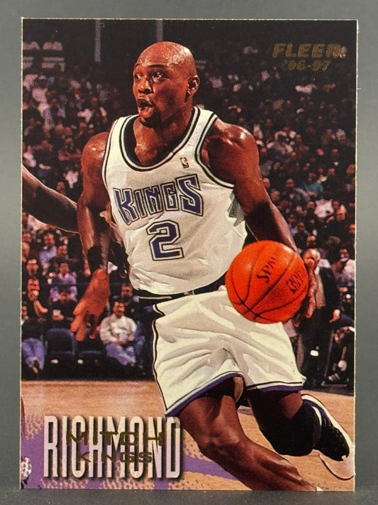 1996-97 Fleer Mitch Richmond basketball card featuring Richmond dribbling for the Kings.