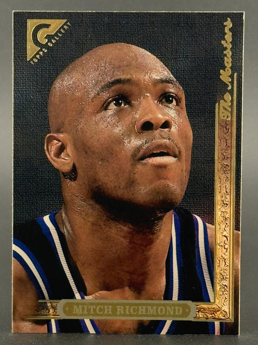 1996 Topps Gallery The Masters Mitch Richmond basketball card, close-up portrait in a black and blue jersey.