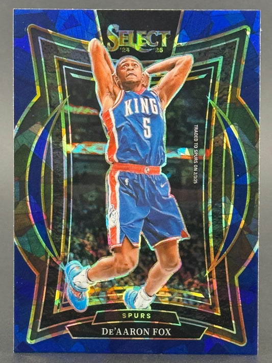 2024-25 Select De'Aaron Fox basketball card featuring a blue disco pattern background.